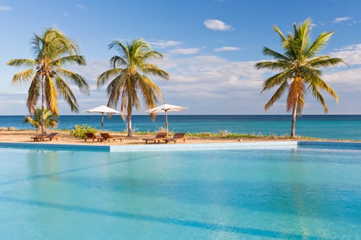 Swimming pool facing the lagoon in a tropical hotel