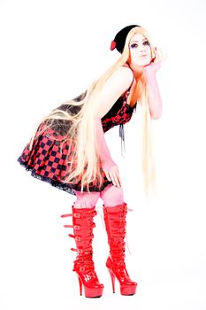 Studio shot of a young girl dressed up like japanese harajuku style girls