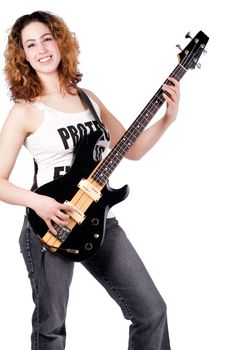 Female guitarist player posing with her guitar with a smile