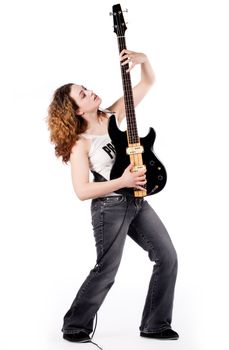 Young female bass guitar player specially isolated on white