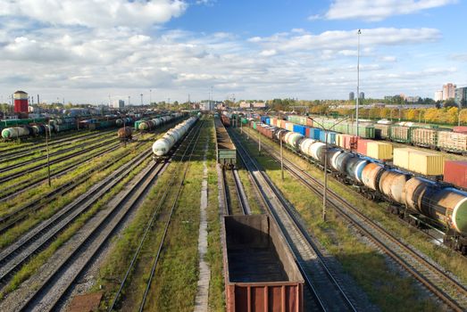 Sorting station with freight trains in summer sunny day