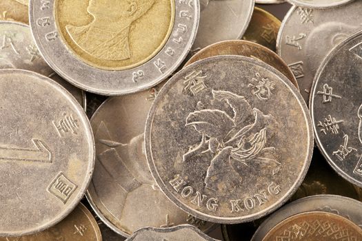 Asian coins with Hong Kong dollar in center.