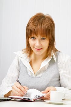 smiling attractive girl with a notebook. Office worker