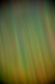 Background, a rainbow of colored vertical stripes.