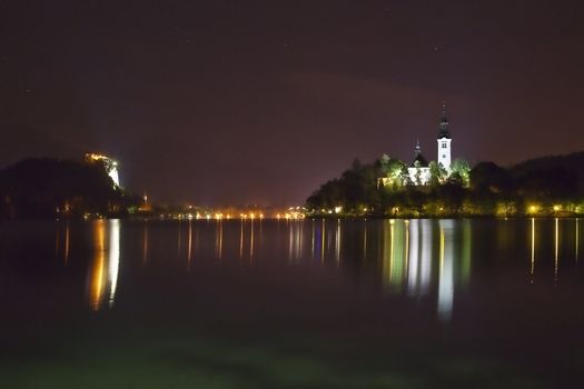 Night picture - Panorama of church on the island in Bled Lake - one of the most beautiful regions of Julian Alps in Slovenia