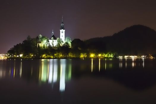 Night picture - Panorama of church on the island in Bled Lake - one of the most beautiful regions of Julian Alps in Slovenia