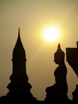 Sunset at the Wat Mahathat temple in the historical park of Sukhothai