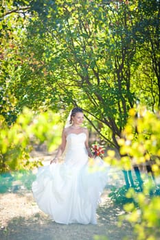  bride dancing in the sunlight outdoors