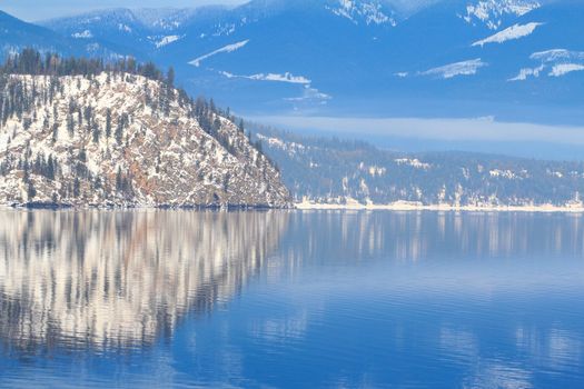 Reflection of Mountain Island and blue skies