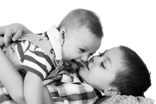 Brothers playing and laughing on the floor