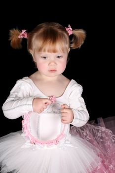 Little ballet toddler wearing a white tutu 