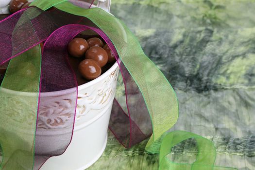 Decorative bucket with chocolate and organza ribbon