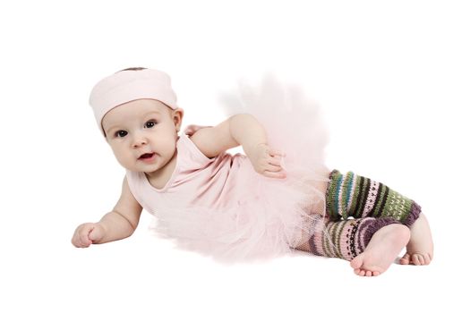 Baby girl wearing a ballet outfit and legwarmers