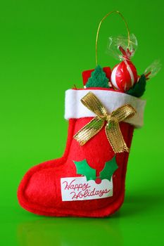 Red Christmas stocking decoration filled with candy
