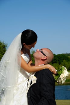 Bride and groom are about to kiss