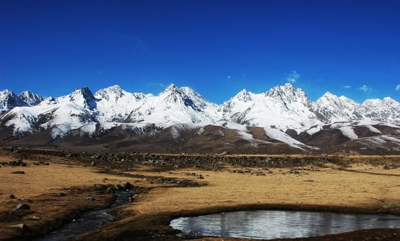 Landscape of mountains covered by snow in winter