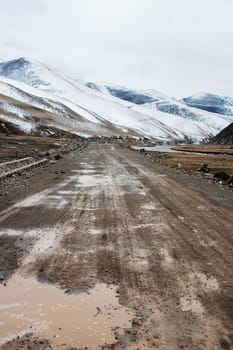 A road in the snowy mountains in winter