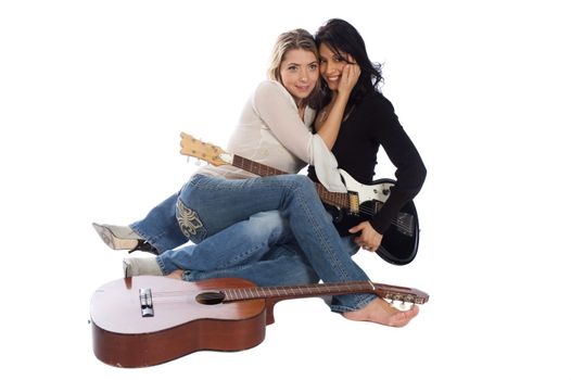 musicians, hispanic woman sharing a tender moment with caucasian girl freind isolated over white