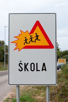 Caution children crossing road sign in Croatia
