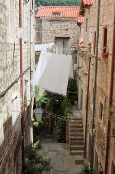 Alley with laundry hanging on a line