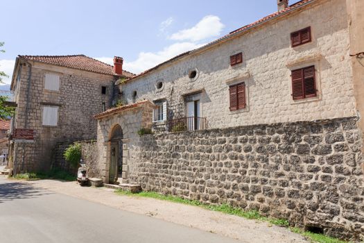 Old stone house with round windows