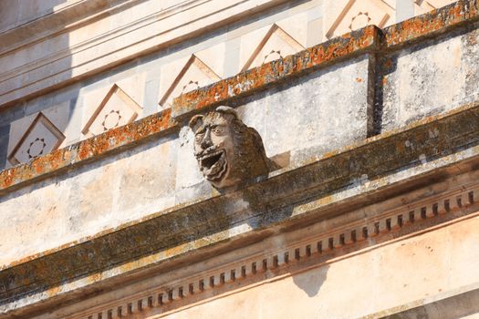 Stone gargoyle on the side of a church