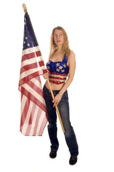 Attractive female American patriot with flag isolated over white