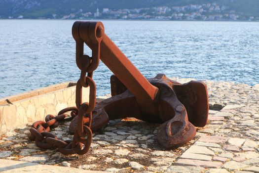 Rusty ship anchor and chain