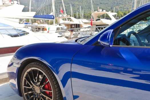 Luxury blue metallic sports car side door and wheel