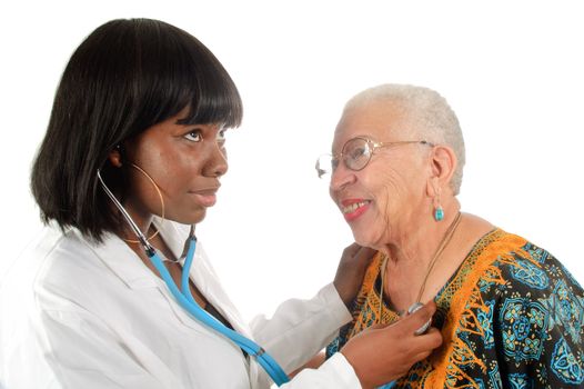Young African American nurse or doctor checking elderly African american woman's heart, isoalted on white.