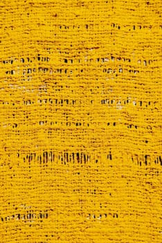 rough yelow acrylic painted cloth background and texture