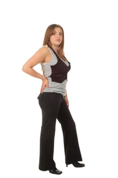 full length body image of a young hispanic woman in fashionable pants isolated over white