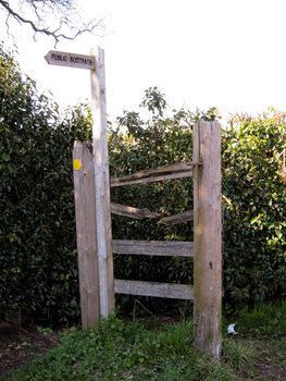 Sign for Public Footpath and broken fence