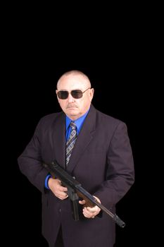 Government agent, FBI agent, with a thompson machine gun over a black background