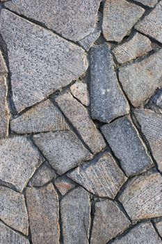 Fragment of a wall revetted with a granite stone