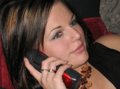 Beautiful young girl talking on her cellular phone