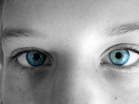 part of a face with blue eyes staring out.