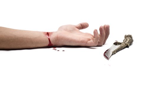 A bloody knife and a cut wrist, isolated on white. This image has innumerous uses like accidents, domestic violence, suicide, murder, hate, etc...
