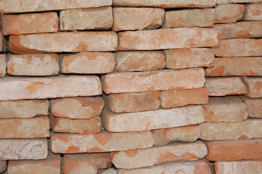 Stockpiled orange bricks