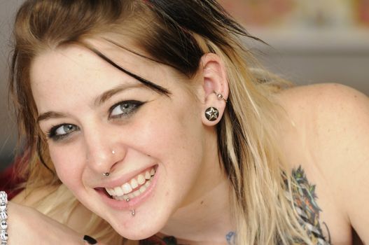 Attractive female American with tattoo's and piercings