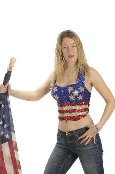 Attractive female American patriot with flag isolated over white