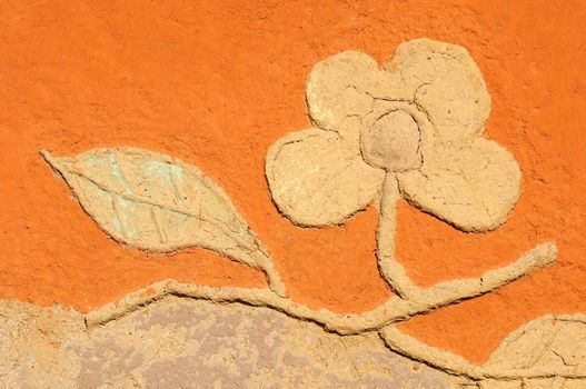 Flowers made from clay at the wall