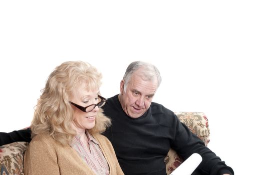 Older couple going over accounts for retirement, isolated on white