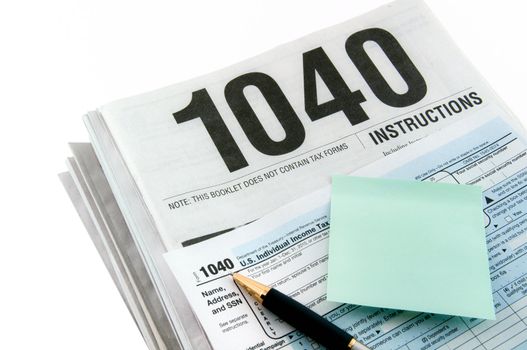 Instructions and form for tax returns preparation with sticker for notes