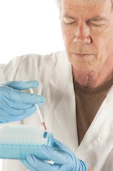 older Research scientist,biologist, doctor or nurse injecting blood plasma into test tubes for analysis