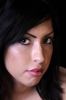 Beautiful young brunette woman in closeup