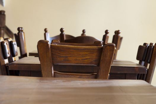 High resolution image. Museum exposition. Ancient furniture. Wooden table and chairs.