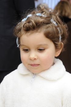 smiling young flower girl at a wedding 