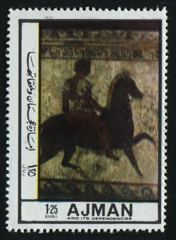 AJMAN - CIRCA 1972: Ancient picture, the person on a horse, circa 1972.