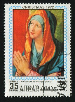 AJMAN - CIRCA 1970: Ancient picture. Maria prays , circa 1970.
